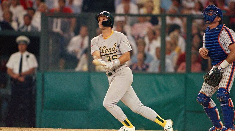 Terry Steinbach of the Oakland A's watches a long fly ball in the fourth inning of on Tuesday, July 12, 1988 night's All-Star game in Cincinnati. Steinbach's sacrifice scored Dave Winfield of the New York Yankees for the American ague’s second run. (AP Photo/Gene Puskar)