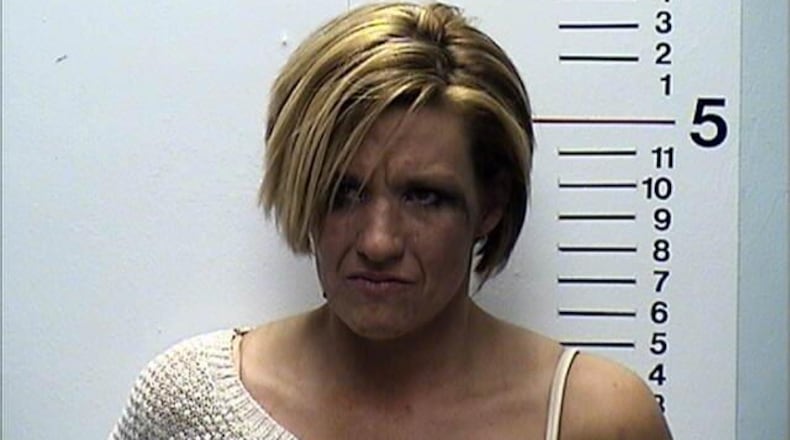 Carmen Statzer, 35, of Monroe, was charged with OVI and driving under suspension