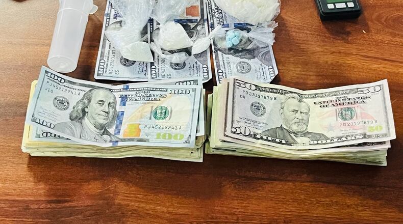 These are the items that were seized during a search warrant of an Oxford apartment. A Hamilton man was charged with two drug felonies. BUTLER COUNTY SHERIFF'S OFFICE