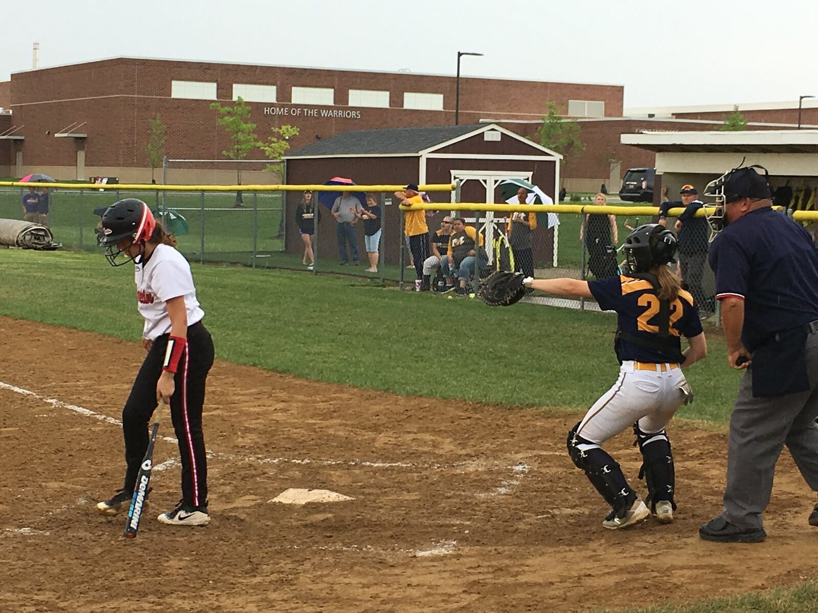 Monroe catcher Sam Schwab (22) points to pitcher Alyssa Wagner after Franklin’s Shelby Raby struck out in the seventh inning of Wednesday’s Division II district semifinal at Lebanon. RICK CASSANO/STAFF