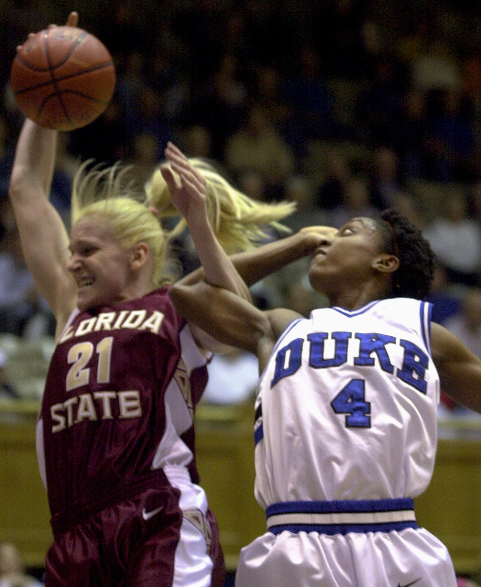 Florida State's Brooke Wyckoff, left, tangles with Duke's Rochelle Parent (4) as they battle for a rebound during the first half Thursday, Feb. 8, 2001, at Cameron Indoor Stadium in Durham, N.C. (AP Photo/Grant Halverson)