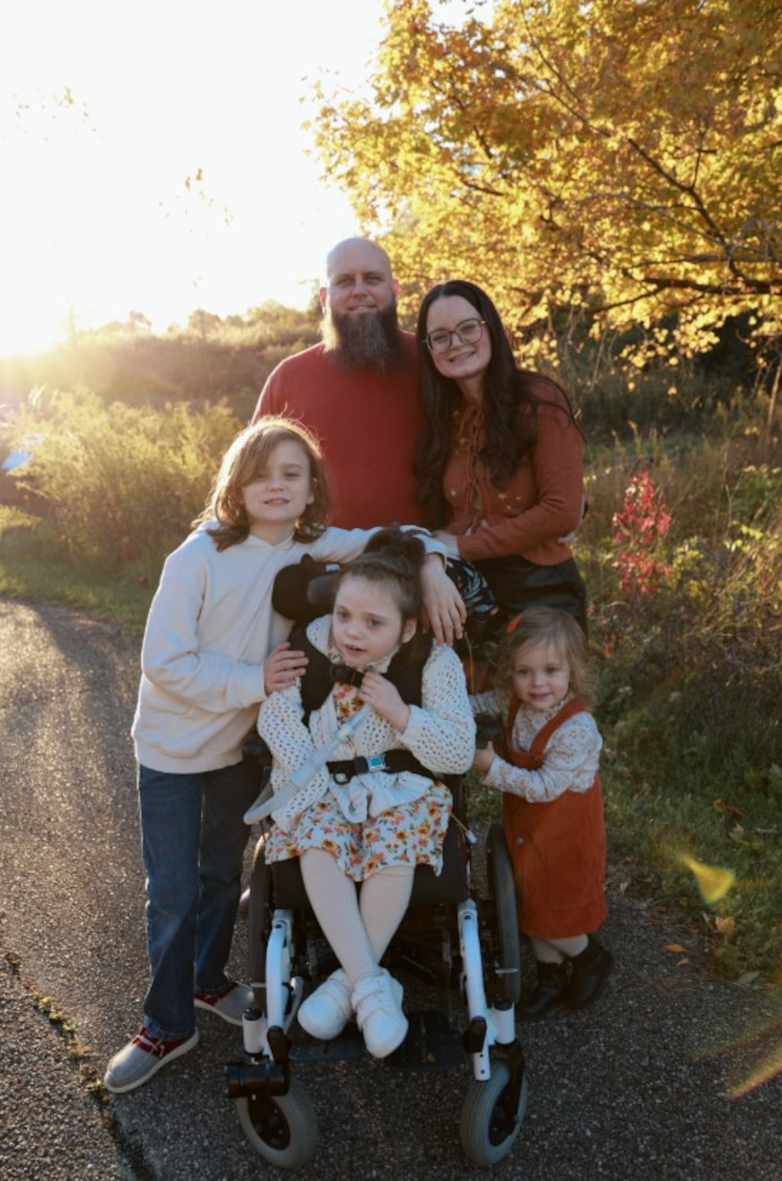 Ty and Megan Wright (back row) with Cael, Lexi and Larkin (from left) in February 2025. CONTRIBUTED