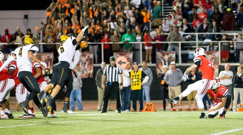 Wayne’s Garrett Russell (32) has a kick blocked by Centerville, including Riley Poulton (6), last Friday night at Wayne. The visiting Elks won 39-22. CONTRIBUTED PHOTO BY RON CHARETTE