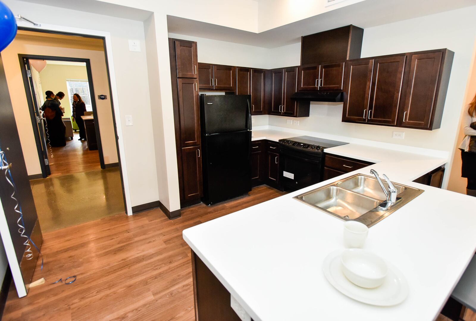 Hope House Mission held a ribbon cutting Feb. 24 for its new men's emergency shelter to support those experiencing homelessness and poverty. The facility has a 50-bed emergency shelter, 30 one-bedroom Permanent Supportive Housing apartments, administrative offices, counseling and case management offices, a chapel, recreation room, dining room with commercial kitchen and health counseling room for nurses and visiting doctors. NICK GRAHAM / STAFF