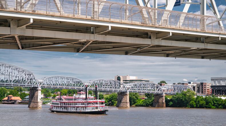 A vintage paddle steamboat cruises down the Ohio River in Cincinnati. ISTOCK