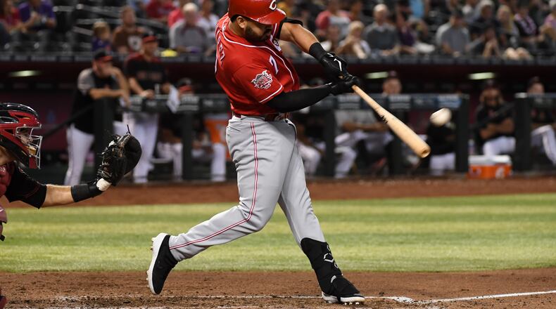 PHOENIX, ARIZONA - SEPTEMBER 15: Eugenio Suarez #7 of the Cincinnati Reds hits a solo home run off of Zac Gallen #59 of the Arizona Diamondbacks during the sixth inning at Chase Field on September 15, 2019 in Phoenix, Arizona. It was the second home run of the game for Suarez. (Photo by Norm Hall/Getty Images)