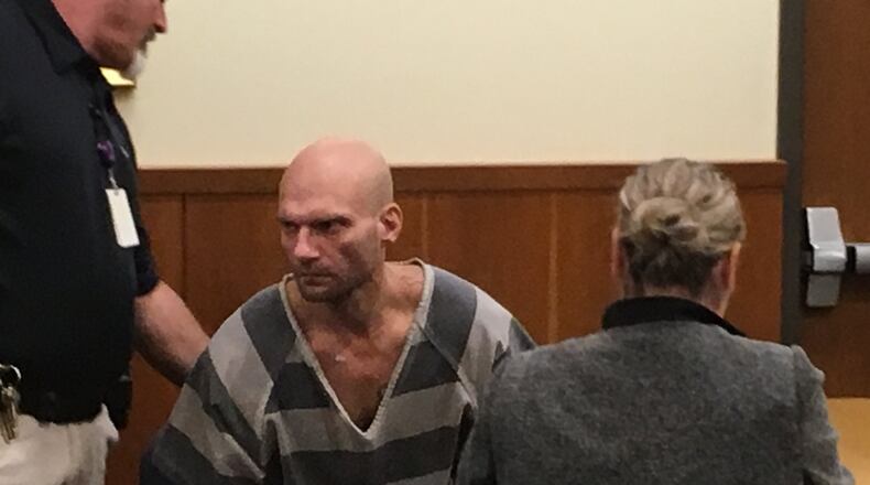 James Carroll is led out of Middletown Municipal Court after Judge James Sherron bound the case over to a Butler County grand jury. Carroll is charged with murder and his bond remained at $1.2 million.