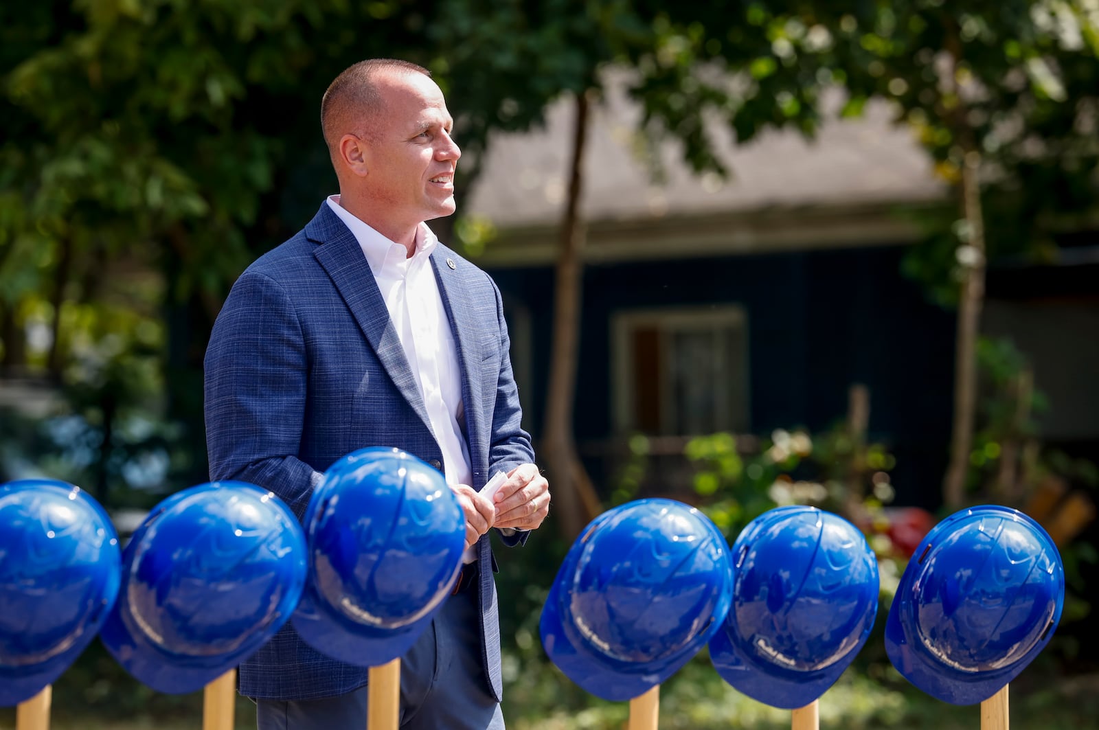 Hamilton city manager Craig Bucheit stands during a groundbreaking at the location of the first Build Back the Block home in the city of Hamilton at 936 East Ave. Thursday, Sept. 4, 2025. It's the first of 12 new homes to be built over the next year as part of Phase 1. This first phase represents more than $3 million of new investment into the neighborhood.NICK GRAHAM/STAFF