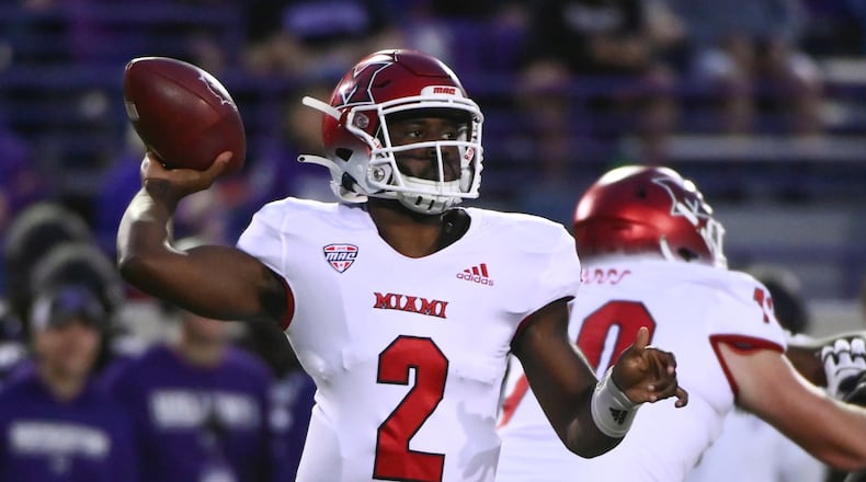 Miami quarterback Aveon Smith looks for a receiver during the first half of the team's NCAA college football game against Northwestern on Saturday, Sept. 24, 2022, in Evanston, Ill. (AP Photo/Matt Marton