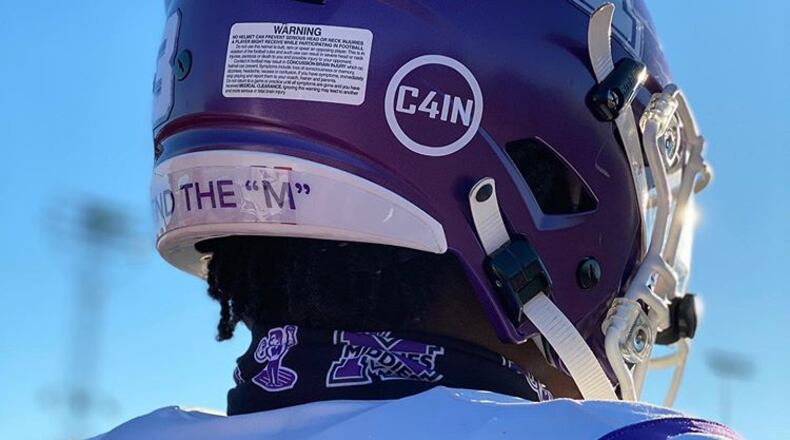 The death of a Middletown 4th grader last week was commemorated Friday by Middletown High School's football team who wore decals on their helmets honoring the passing of Cain Adkins. (Provided Photo\Journal-News)