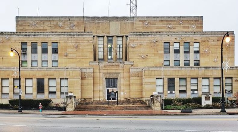 The former Hamilton municipal building at 20 High St. will not be developed into 50 market-rate apartments by the developer who is creating The Marcum complex of apartments, restaurants and retail shops. He tried, but was unable to find a way. NICK GRAHAM/STAFF