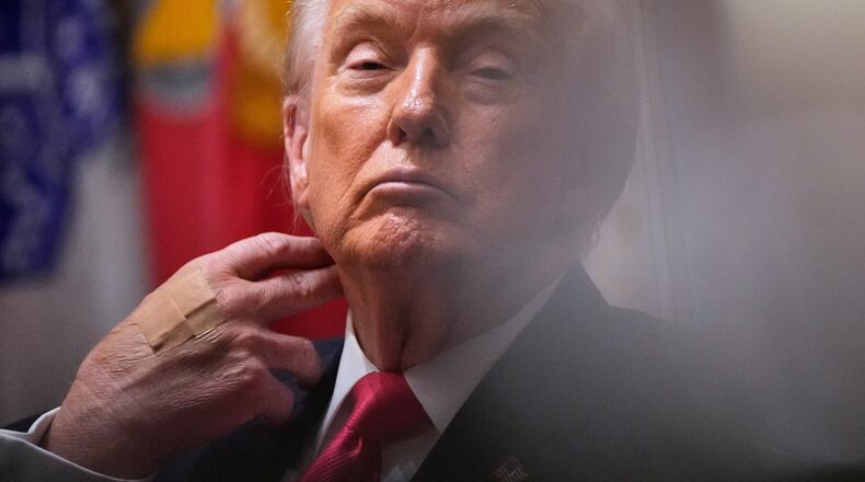 President Donald Trump listens during a Cabinet meeting at the White House, Tuesday, Dec. 2, 2025, in Washington. (AP Photo/Julia Demaree Nikhinson)
