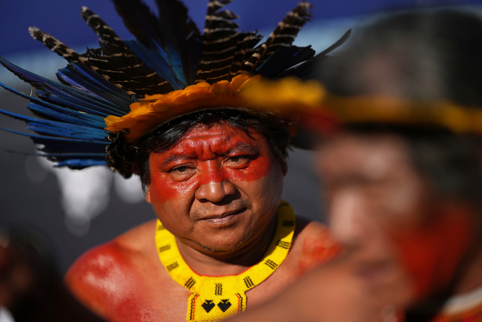 An Indigenous man protests against the auction of dozens of oil blocks, including blocks near the mouth of the Amazon River, in Rio de Janeiro, Tuesday, June 17, 2025. (AP Photo/Silvia Izquierdo