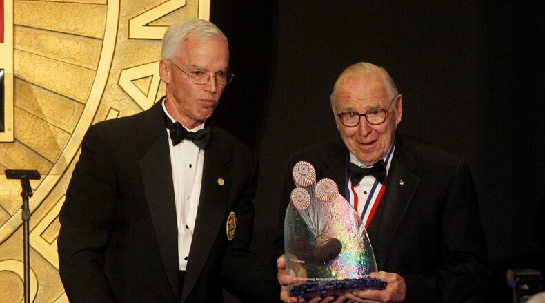 Apollo 13 astronaut James A. Lovell (right) received the first Neil Armstrong Outstanding Achievement Award at the National Aviation Hall of Fame ceremony held in October 2015 at the National Museum of the United States Air Force at Wright-Patterson Air Force Base. At left is William Harris Jr., the National Aviation Hall of Fame chairman of the board. LISA POWELL / STAFF
