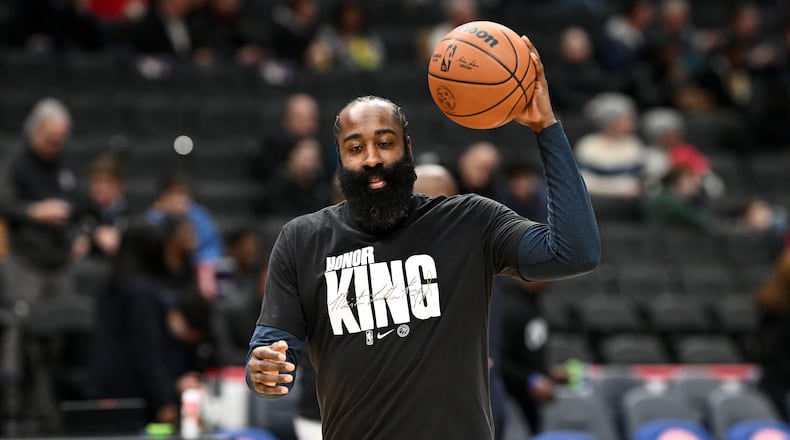 Los Angeles Clippers guard James Harden warms up while wearing a shirt paying tribute to Martin Luther King Jr. before of an NBA basketball game against the Washington Wizards, Monday, Jan. 19, 2026, in Washington. (AP Photo/Nick Wass)