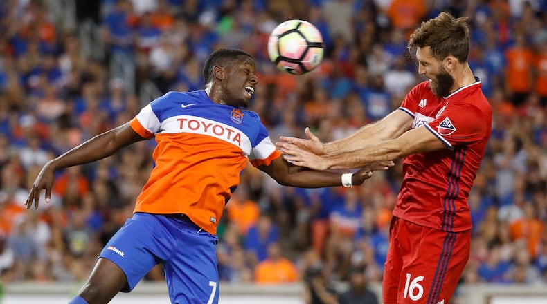 FC Cincinnati forward Kadeem Dacres (7) and Chicago Fire defender Jonathan Campbell (16) vie for a header in the second half of a U.S. Open Cup soccer match, Wednesday, June 28, 2017, in Cincinnati. FC Cincinnati won 3-1 on penalty kicks. (AP Photo/John Minchillo)