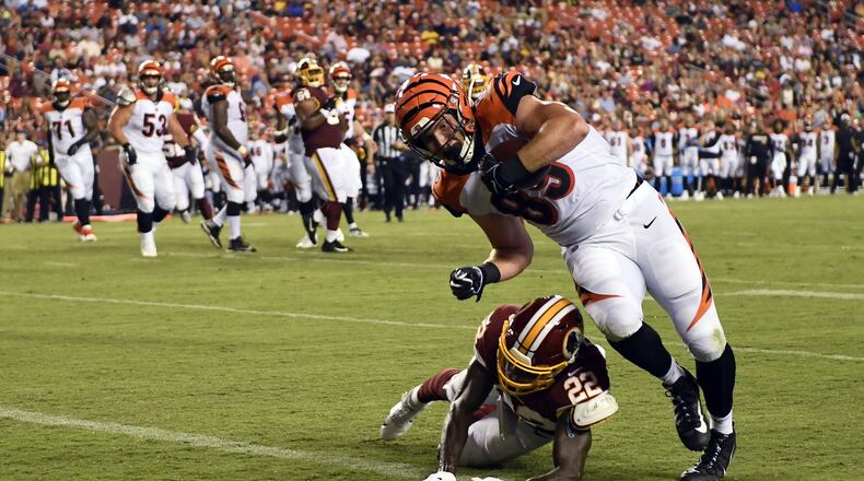 Cincinnati Bengals tight end Drew Sample (89) runs over Washington Redskins defensive back Deshazor Everett (22) for a touchdown during the second quarter of an NFL preseason football game in Landover, Md., Thursday, Aug. 15, 2019. (AP Photo/Susan Walsh)
