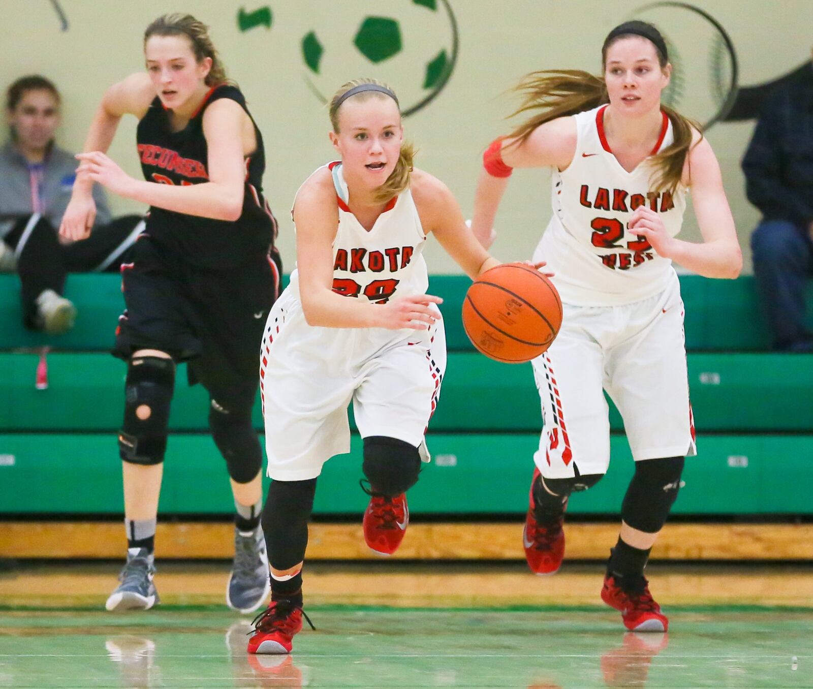 Lakota West guard Ally Haar (20) leads a fast break during the Firebirds’ Division I district final win over Tecumseh at Harrison on Feb. 27, 2016. GREG LYNCH/STAFF