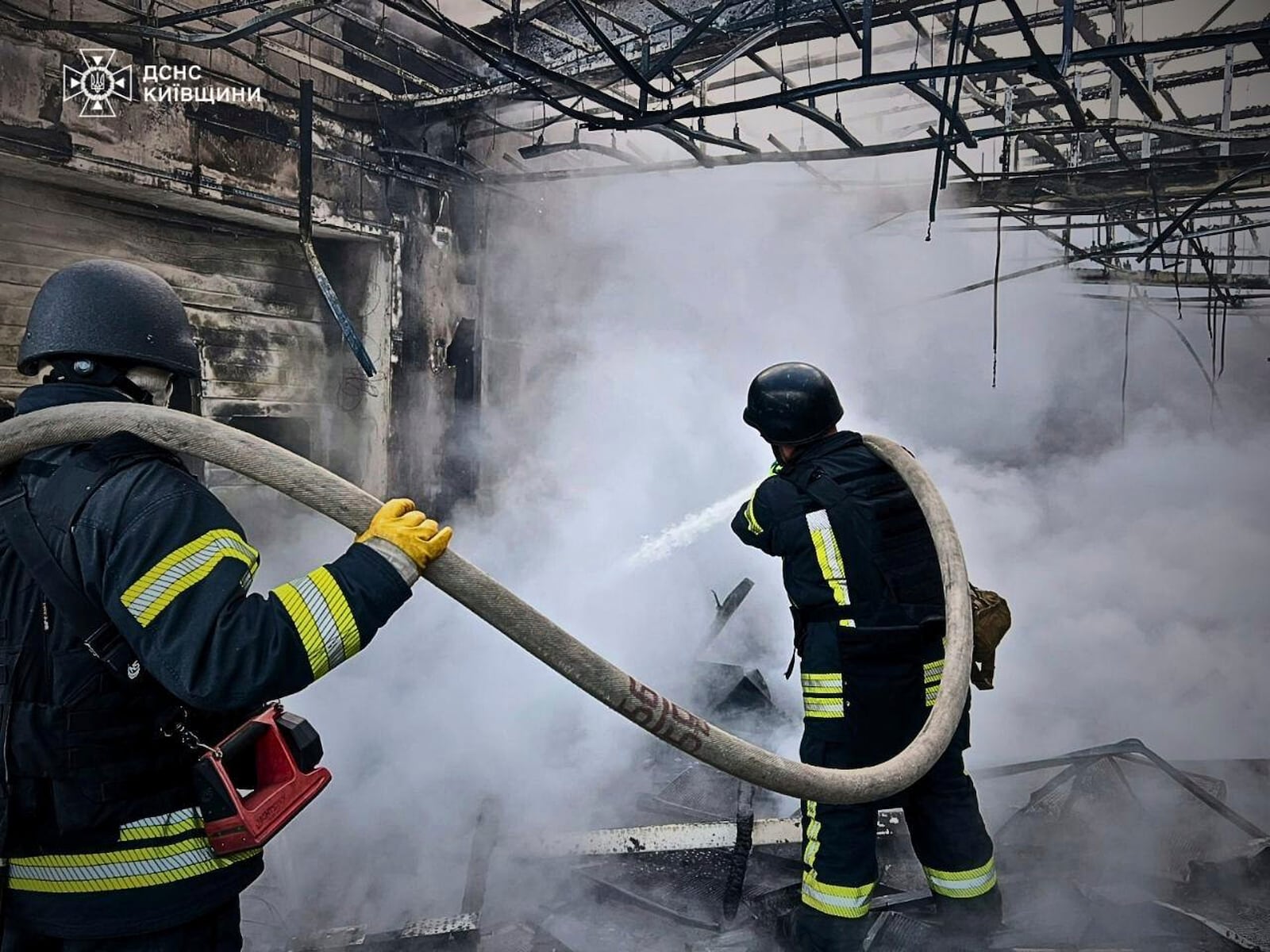 In this photo provided by the Ukrainian Emergency Service, firefighters put out the fire following Russia's drone attack in the Kyiv region, Ukraine, Sunday, May 18, 2025. (Ukrainian Emergency Service via AP)