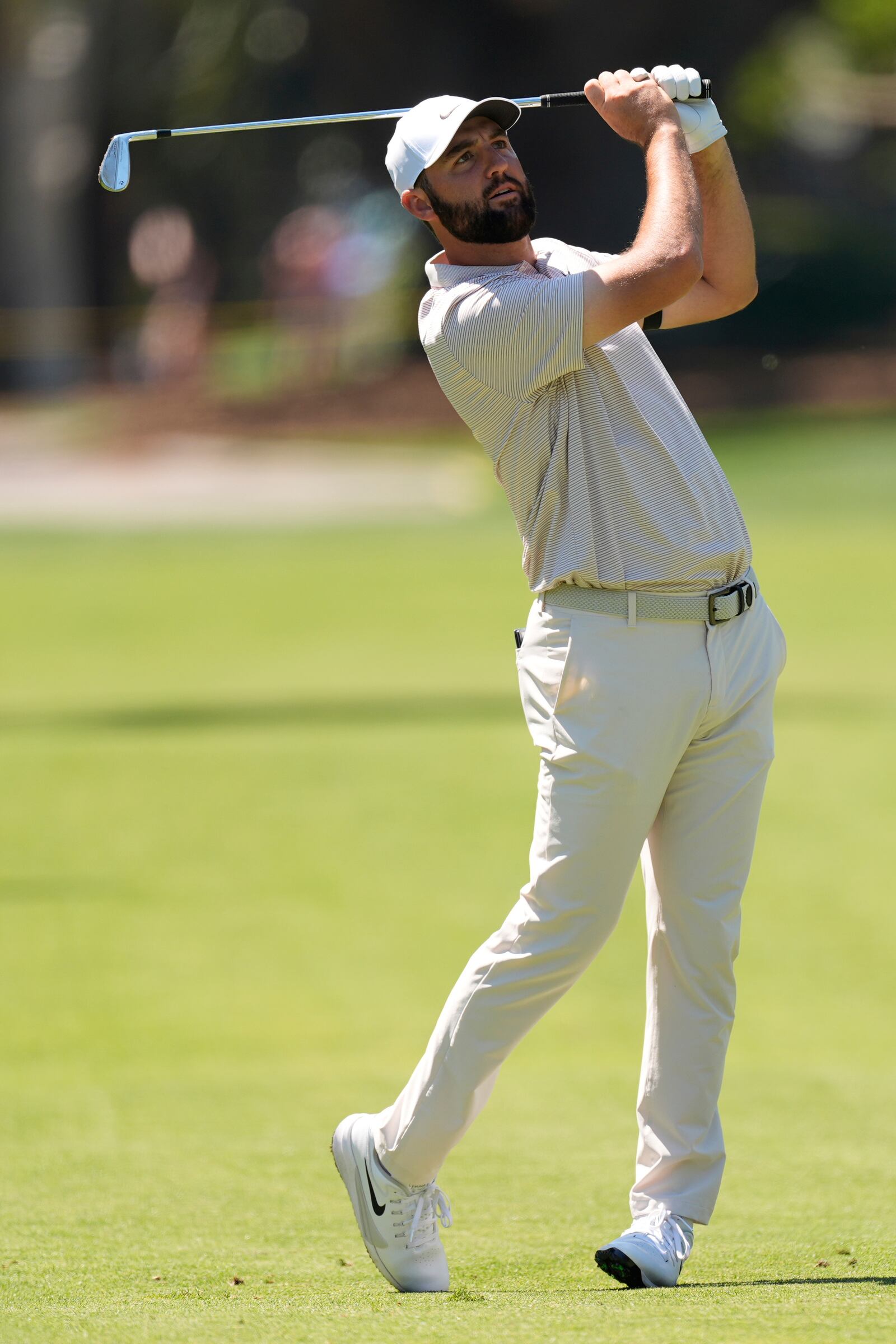 Scottie Scheffler hits from the fairway of the eighth hole during the first round of the RBC Heritage golf tournament, Thursday, April 17, 2025, in Hilton Head Island, S.C. (AP Photo/Mike Stewart)