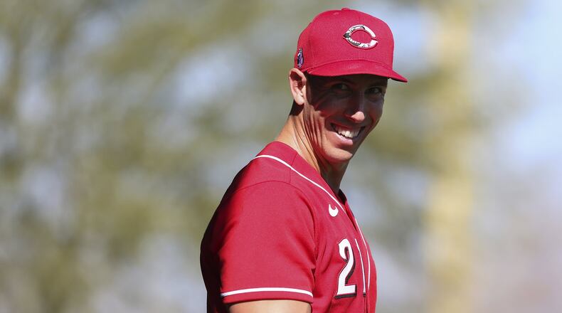 Cincinnati Reds relief pitcher Michael Lorenzen (21) smiles at the conclusion of a bullpen session, Monday, Feb. 17, 2020, at the baseball team’s spring training facility in Goodyear, Ariz. (Kareem Elgazzar/The Cincinnati Enquirer via AP)