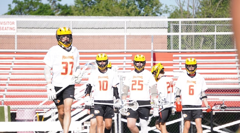 The Fenwick boys lacrosse team warms up before facing Bellbrook in a Division II regional final last week. Chris Vogt/CONTRIBUTED