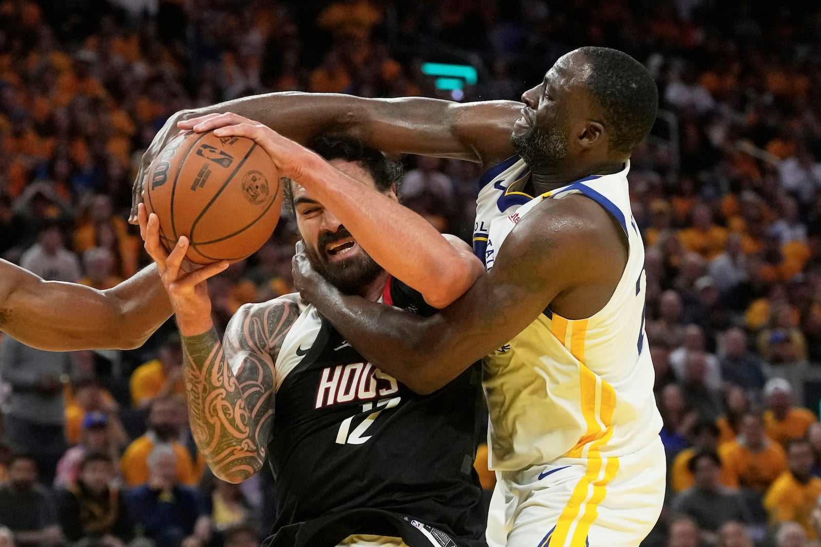 Houston Rockets center Steven Adams, left, is fouled by Golden State Warriors forward Draymond Green during the second half of Game 3 of an NBA basketball first-round playoff series in San Francisco, Saturday, April 26, 2025. (AP Photo/Jeff Chiu)