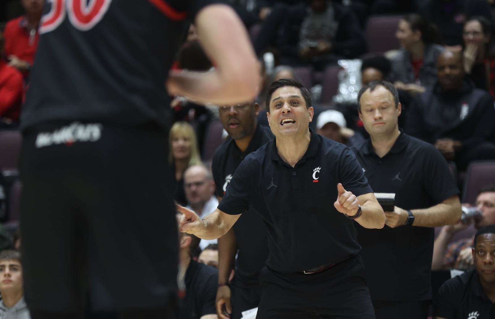Cincinnati's Wes Miller coaches during a game against Dayton on Saturday, Dec. 16, 2023, at the Heritage Bank Center in Cincinnati. David Jablonski/Staff