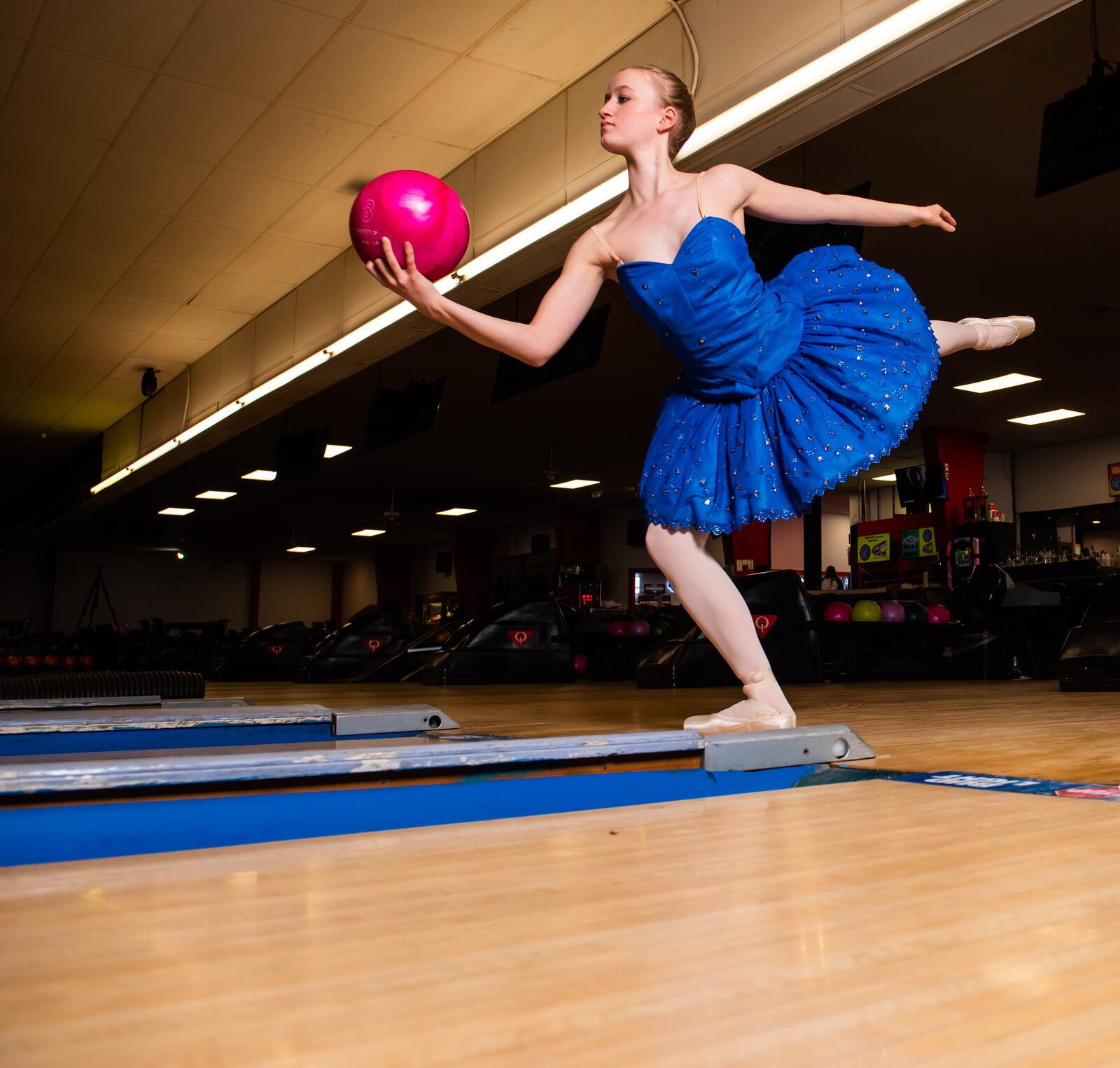 Clare Sherman, 15, with Miami Valley Ballet Theatre, poses for a photo at Pohlman Lanes and Family Entertainment Complex on Pyramid Hill Blvd. in Hamilton.
  Hamilton’s very own Miami Valley Ballet Theatre dancers are trading out their ballet slippers for bowling shoes, for a very special performance at Pohlman Lanes. Their brand new show is a Fab Four inspired production featuring the music of the Beatles that features an exciting mix of contemporary and modern dance. The Ballet, Beatles and Bowling show is part of Fitton Center's "Outside The Box" series showcasing live arts at around Hamilton. The performance is Sunday, April 11 from 3-5 p.m. NICK GRAHAM / STAFF 