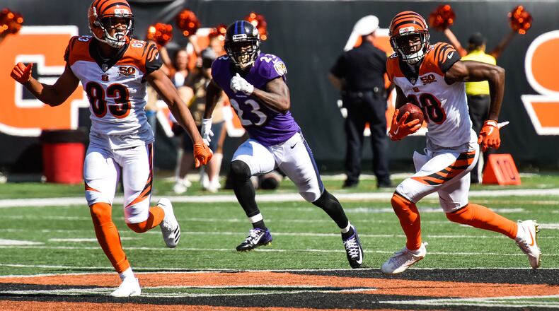 The Cincinnati Bengals wide receiver Tyler Boyd (83) looks to block for wide receiver A.J. Green as he carries the ball during their 20-0 loss to the Baltimore Ravens Sunday, Sept. 10 at Paul Brown Stadium in Cincinnati. NICK GRAHAM/STAFF