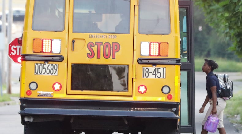 A child walks onto a Dayton Public Schools bus on Dearborn Avenue on Tuesday, Aug. 12, 2025. Private and charter school enrollment in Ohio has soared in the last five years while traditional K-12 enrollment has fallen by nearly 26,895 students, or 1.8%.
BRYANT BILLING / STAFF
