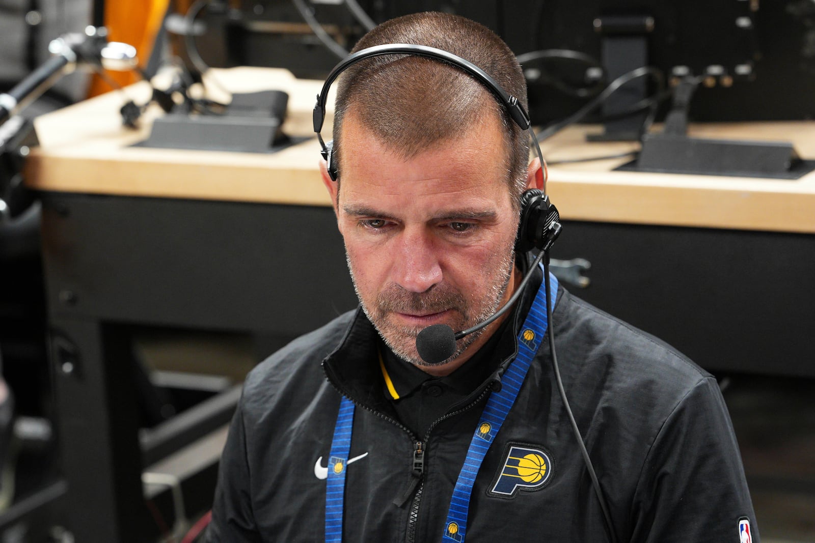 Dean Heaviland, vice president of game operations at Pacers Sports & Entertainment, works before Game 3 of the Eastern Conference finals of the NBA basketball playoffs between the Indiana Pacers and the New York Knicks, Sunday, May 25, 2025, in Indianapolis. (AP Photo/AJ Mast)