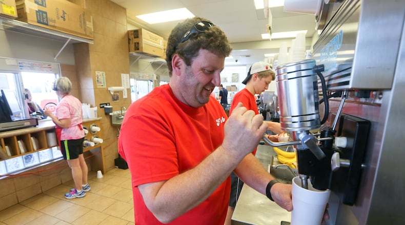 Flub’s owner Brian Connaughton works alongside his son Noah and long-time employee Pam Farquis at the Hamilton location. The business also has locations in Fairfield and Ross Twp. GREG LYNCH / STAFF