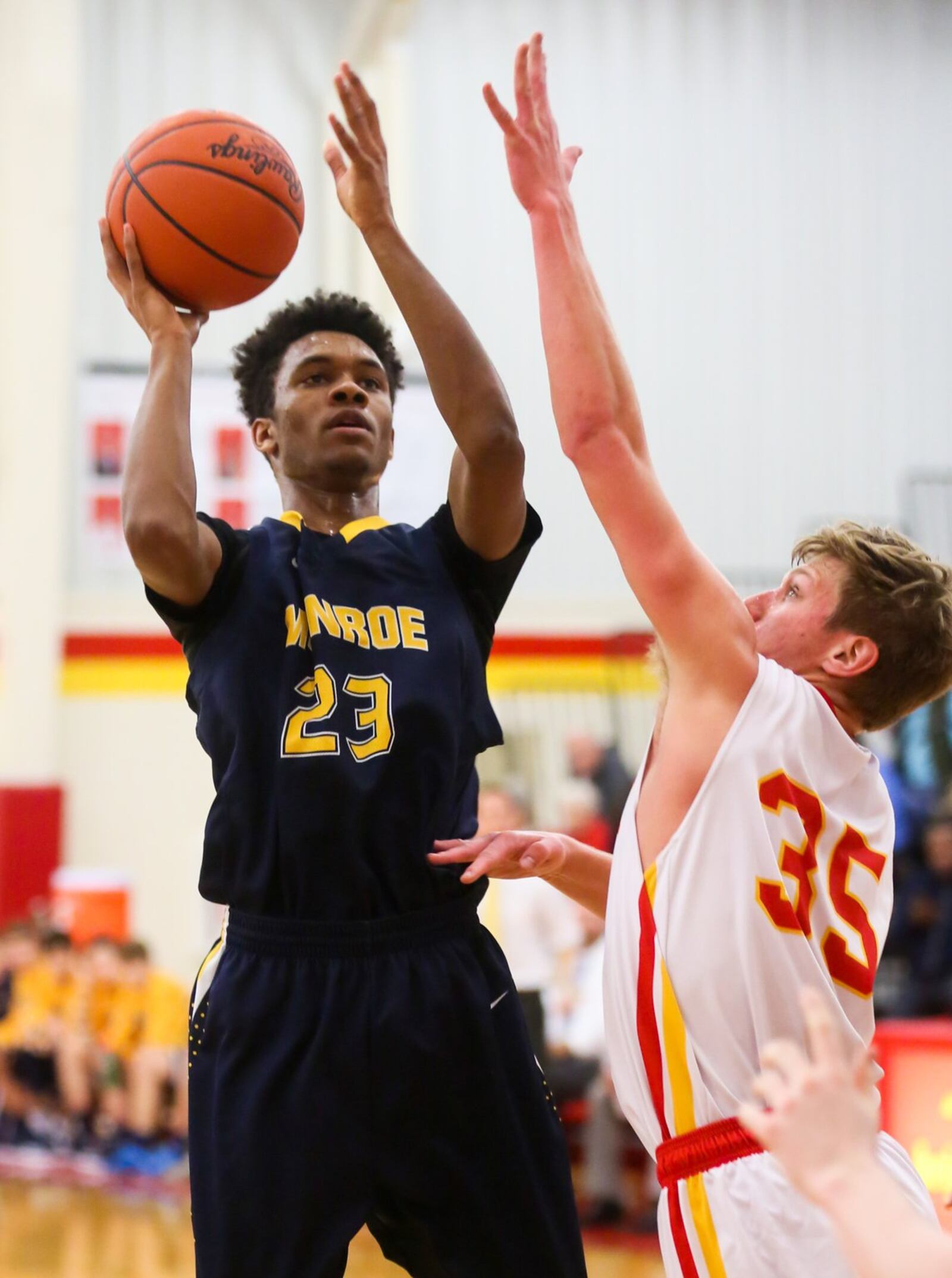 Monroe forward Tristan Backas (23) takes a shot over Fenwick defender Luke Bradshaw (35) during their game at Fenwick on Tuesday night. GREG LYNCH/STAFF