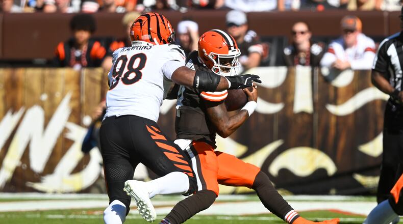 Cleveland Browns quarterback Deshaun Watson is sacked by Cincinnati Bengals defensive tackle Sheldon Rankins (98) in the first half of an NFL football game, Sunday, Oct. 20, 2024, in Cleveland. (AP Photo/David Richard)