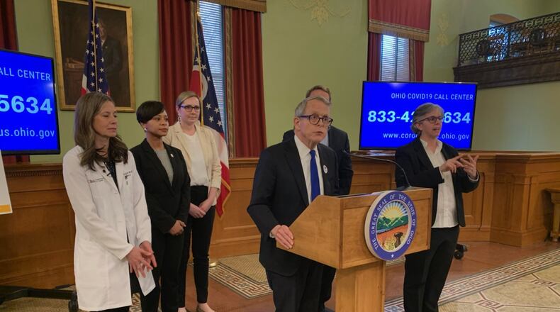 Gov. Mike DeWine and other administration leadership address the latest in the coronavirus outbreak response. LAURA BISCHOFF/STAFF