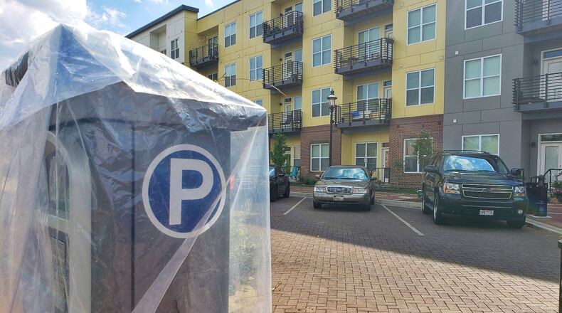 Hamilton has installed eight parking-meter kiosks on High Street and near The Marcum development of apartments, restaurants and other businesses. The kiosks, which each serve several parking spaces, will be operational in about three weeks. NICK GRAHAM/STAFF