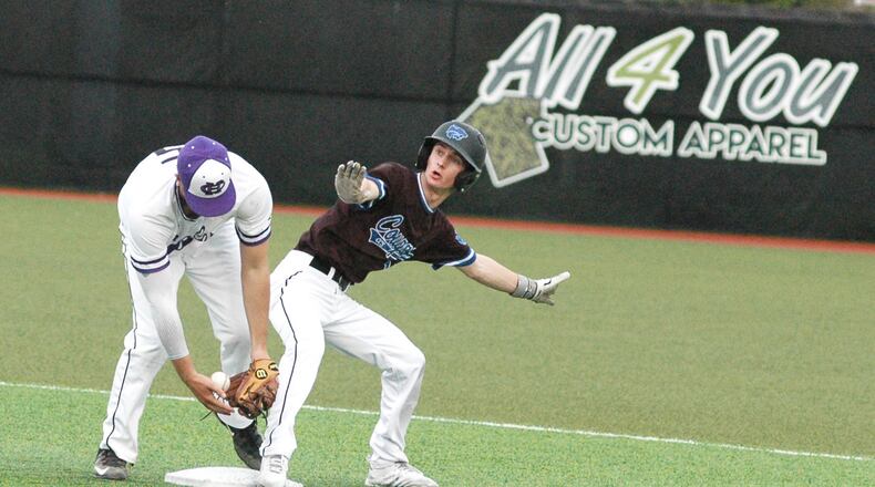 Cincinnati Christian's Alex Johnson is safe at second base despite the efforts of Cincinnati Hills Christian Academy's Colin Ames during Thursday's Miami Valley Conference baseball game at Prasco Park's Legacy Field in Mason. CHCA won 3-2. RICK CASSANO/STAFF