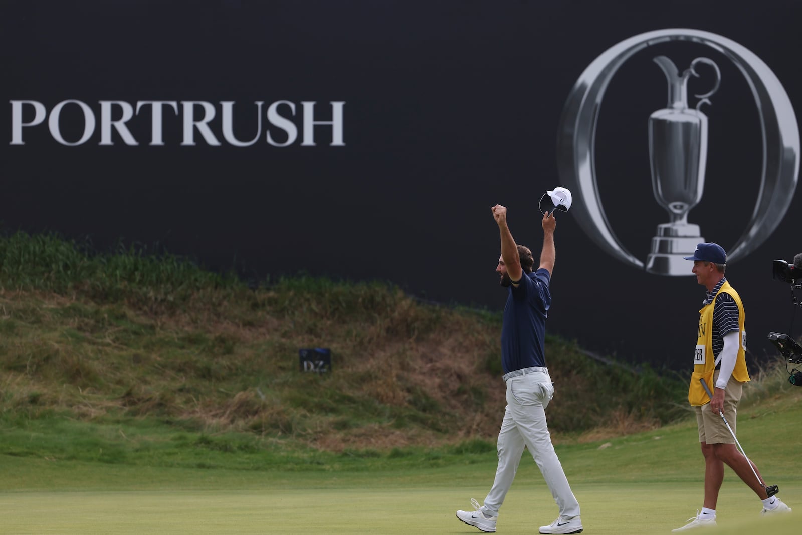 Scottie Scheffler of the United States, celebrates winning the British Open golf championship at the Royal Portrush Golf Club, Northern Ireland, Sunday, July 20, 2025. (AP Photo/Peter Morrison)