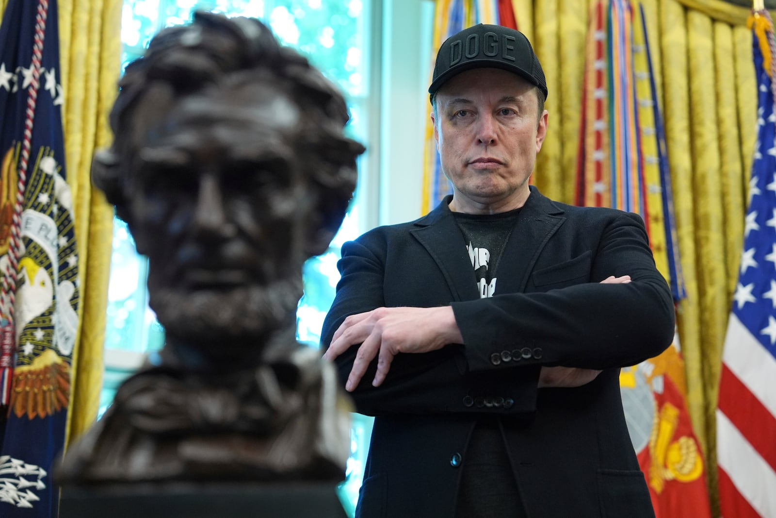 FILE - Elon Musk listens as President Donald Trump speaks during a news conference in the Oval Office of the White House, May 30, 2025, in Washington. (AP Photo/Evan Vucci, File)