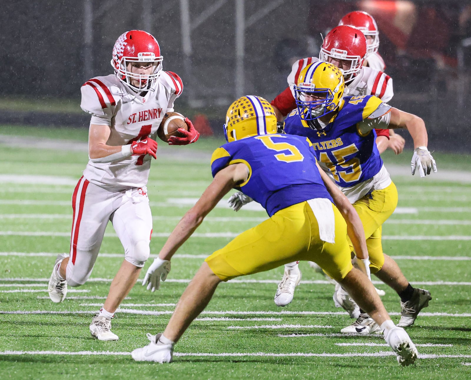 St. Henry senior receiver Jack Huelsman runs during the second half of the Division VII, Region 28 championship on Friday, Nov. 21 at Mercy Health/Wapak VFW Field in Wapakoneta. BRYANT BILLING/STAFF
