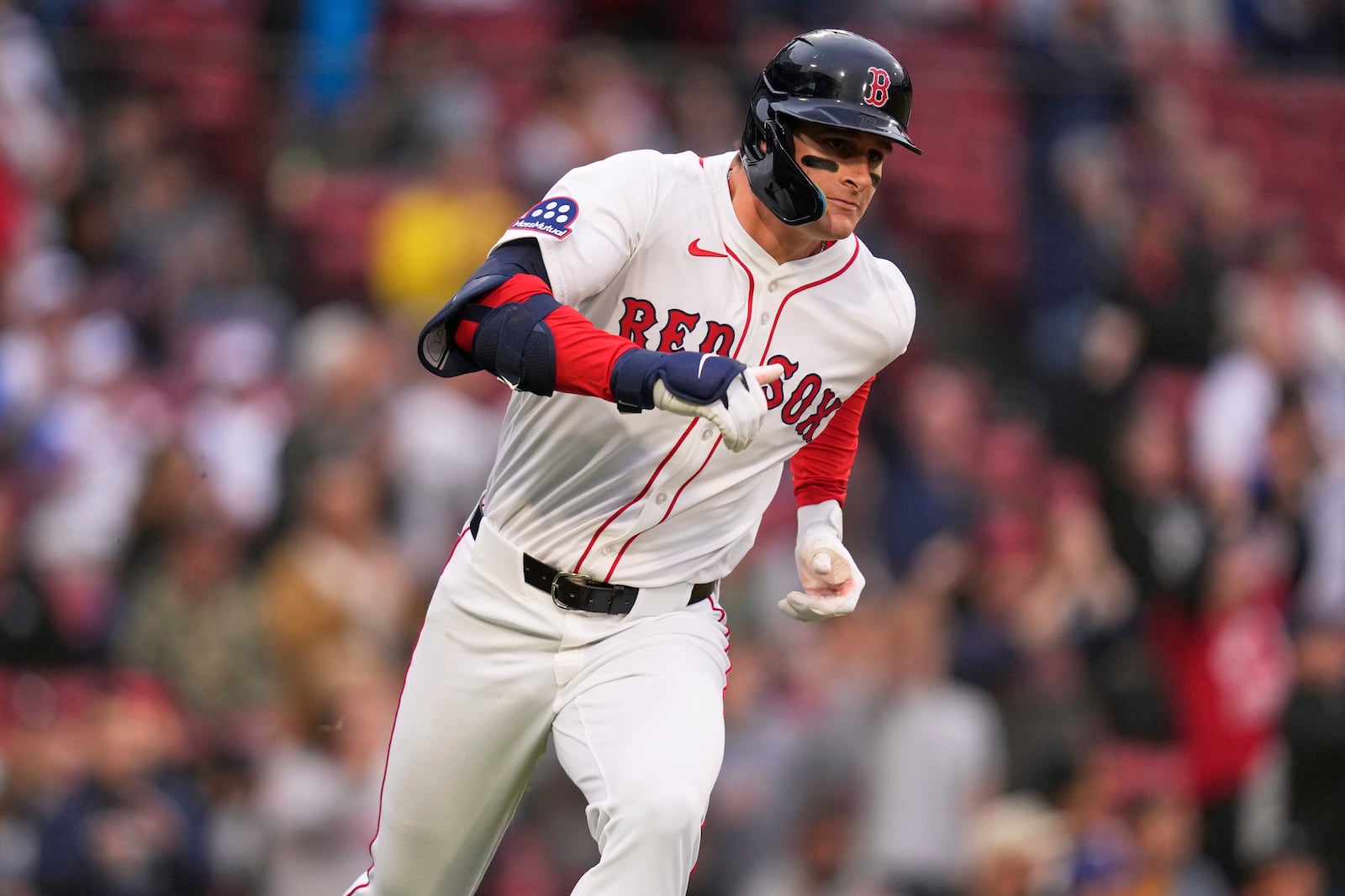 Boston Red Sox rookie Roman Anthony runs down the first base line on his two RBI double, his first major league hit, during the first inning of a baseball game against the Tampa Bay Rays at Fenway Park, Tuesday, June 10, 2025, in Boston. (AP Photo/Charles Krupa)