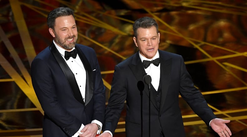 Actor/director Ben Affleck (left) and actor/producer Matt Damon speak onstage during the 89th Annual Academy Awards on Feb. 26, 2017 in Hollywood, Calif. Both men were extras in 1989’s “Field of Dreams.” (Photo by Kevin Winter/Getty Images)