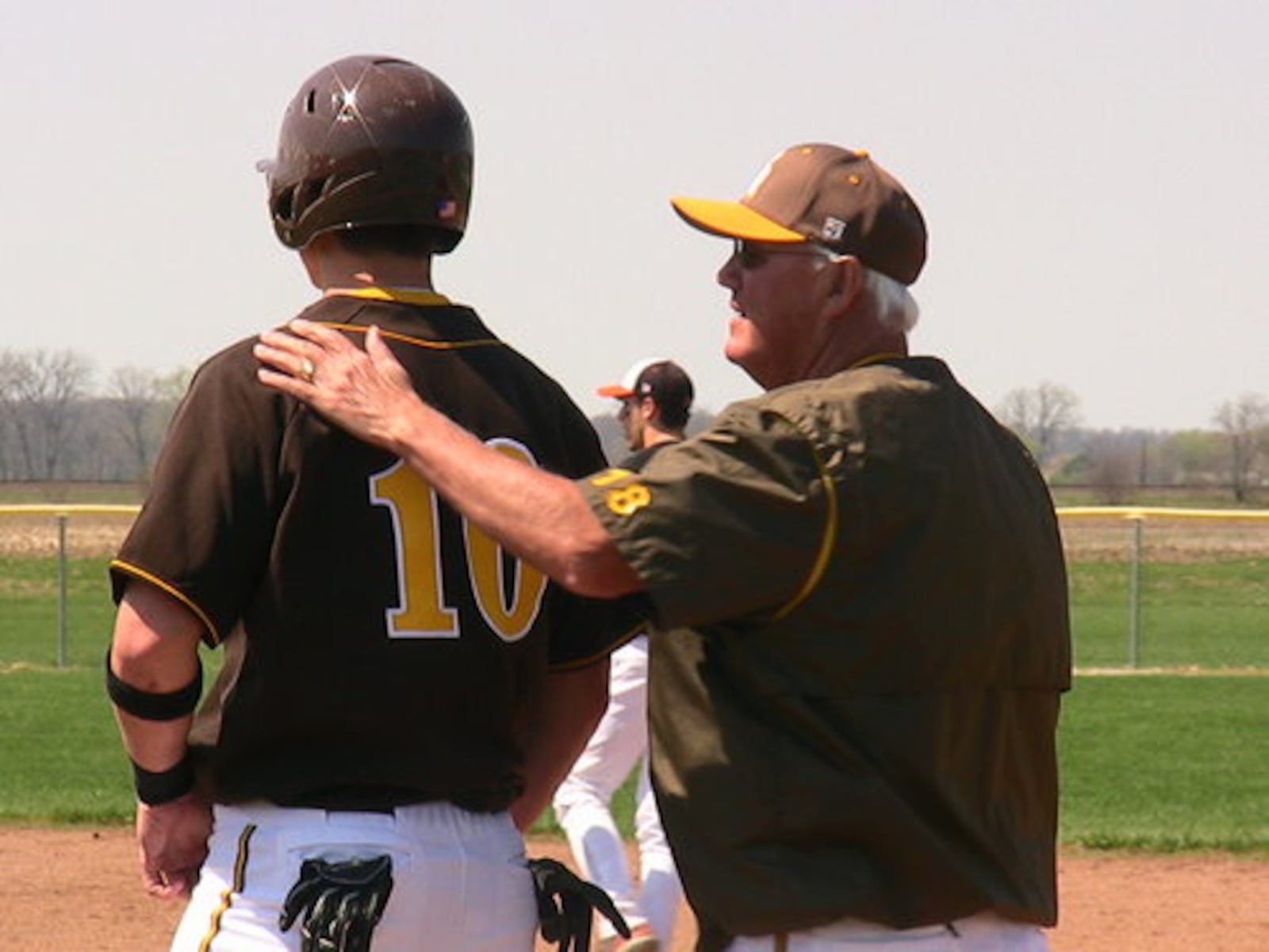 KR first-base coach Andy Fitzwater, left, and junior John McKinney. Kenton Ridge beat host West Liberty-Salem 11-4 on Saturday, April 10, 2010.