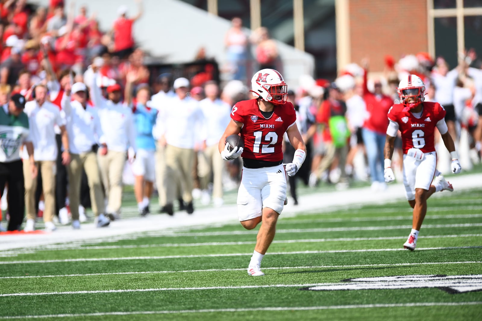 Miami linebacker Corban Hondru returns an interception for a touchdown against UNLV on Saturday afternoon at Yager Stadium. KYLE HENDRIX / CONTRIBUTED