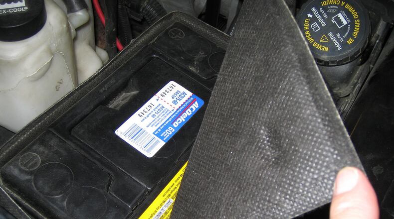 To help protect the battery from engine heat, many vehicle manufacturers use an insulating cover over or around the battery. Heat is hard on any battery. (James Halderman photo)