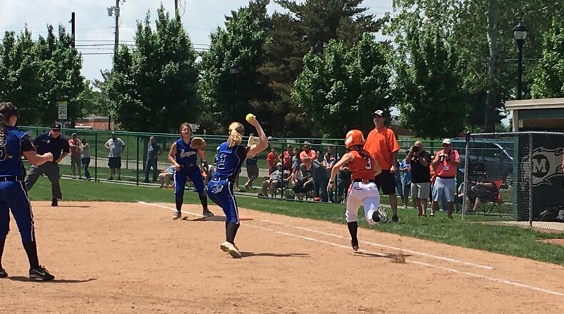 Bradford’s Chelsea Gill puts down a successful sacrifice bunt during Sunday afternoon’s Division IV district final against Cincinnati Christian at Mason. That’s CCS first baseman Jenna Monk fielding the ball and and throwing to second baseman Karli Head as pitcher Briahna Bush watches. RICK CASSANO/STAFF