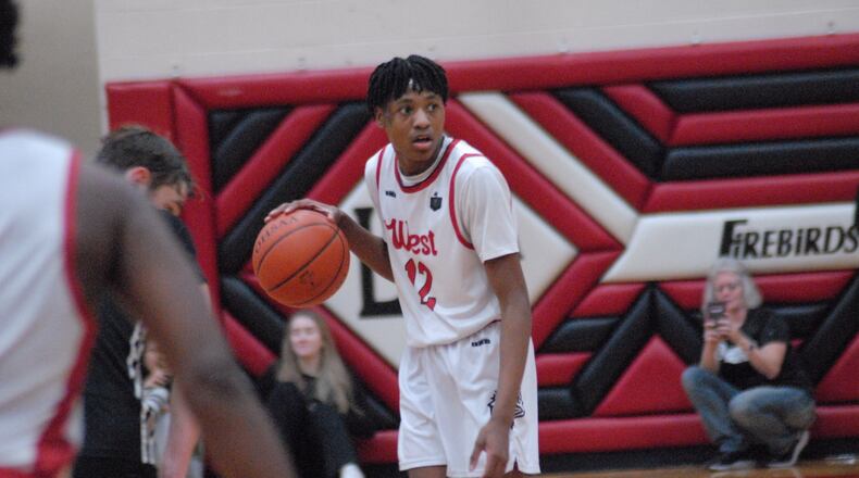 Lakota West freshman Josh Tyson surveys the court against Lakota East on Friday. Chris Vogt/CONTRIBUTED