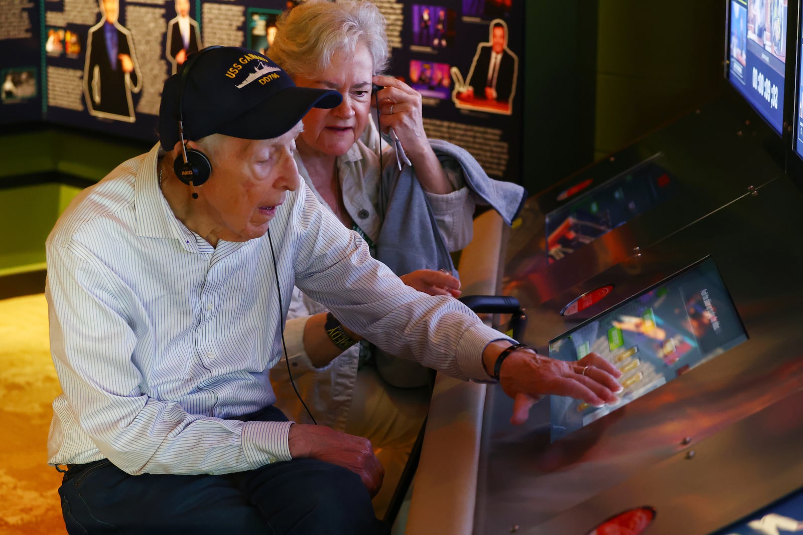 Mario and Gail Cirasunda, of Orchard Park, N.Y., interact with one of the museum's touch screen exhibits during a Memory Cafe event at the National Comedy Center Monday, May 5, 2025, in Jamestown, N.Y. (AP Photo/Jeffrey T. Barnes)