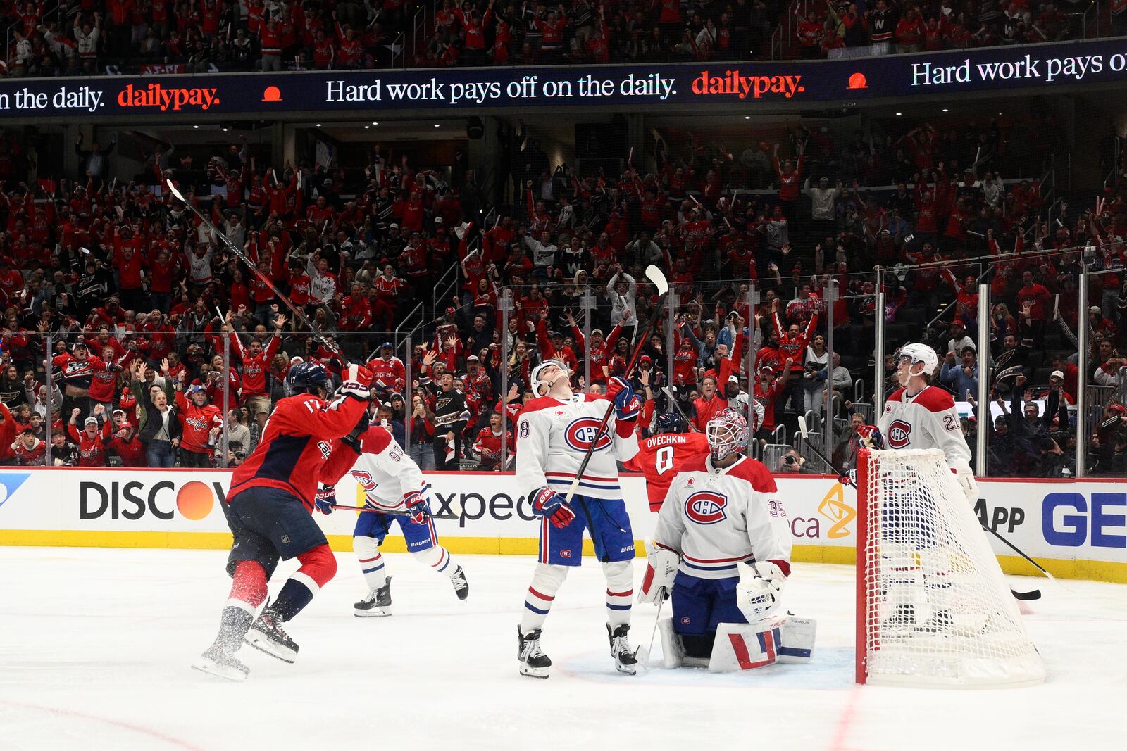 Montreal Canadiens goaltender Sam Montembeault (35) and others react after Washington Capitals left wing Alex Ovechkin (8) scored the winning goal in overtime of Game 1 of a first-round NHL hockey playoff series Monday, April 21, 2025, in Washington. (AP Photo/Nick Wass)